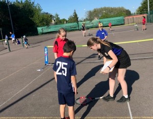 Spinning the racket to decide who serves first at Melbourn VC