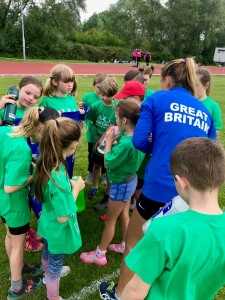 Jade signing t-shirts for the children.